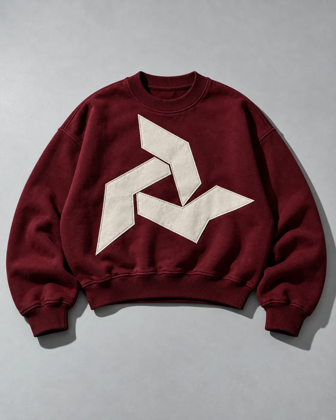 Burgundy crewneck with a large off-white stitched angular emblem